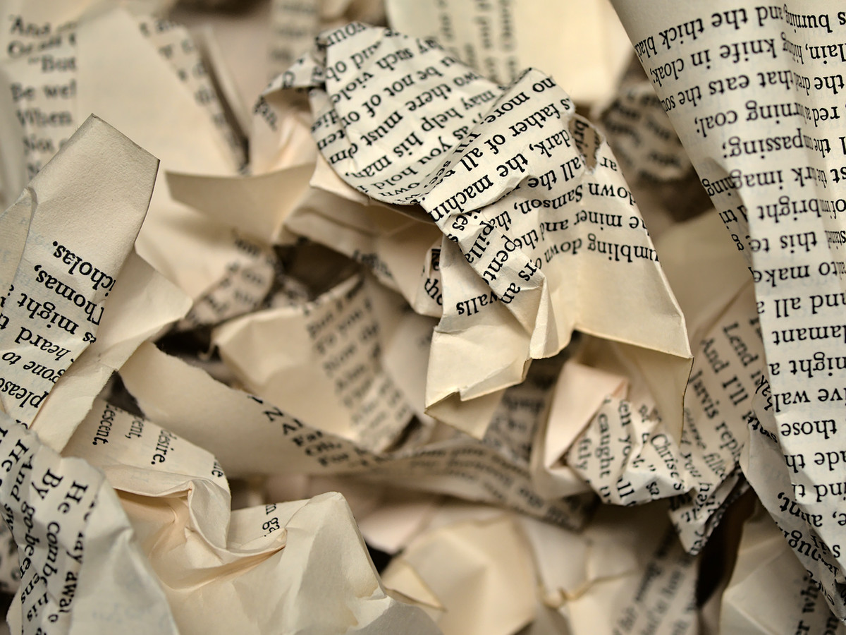crumpled up pieces of pages from a book